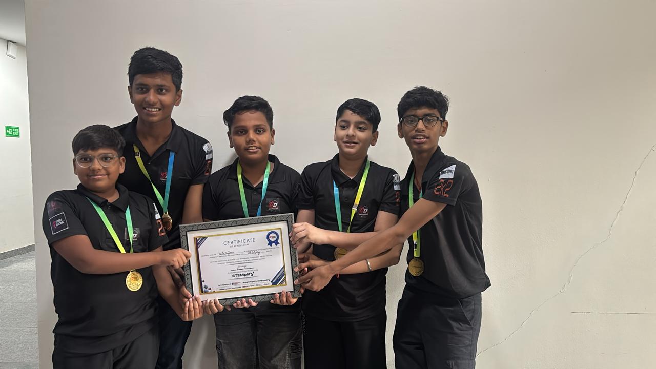 Devil Drifters team holding certificate with medals